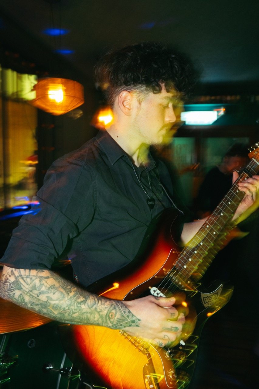 Jack performing guitar live as Raskyjack